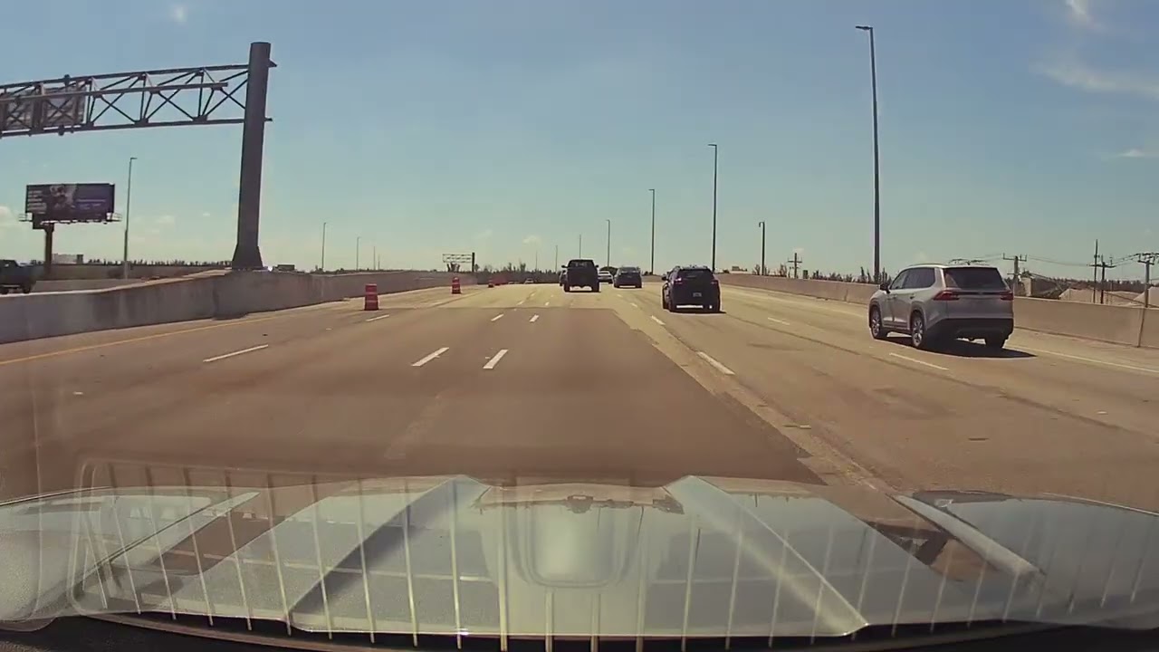 Driving south on I75 exiting onto the South Turnpike heading towards Miami. Sunday traffic is light.