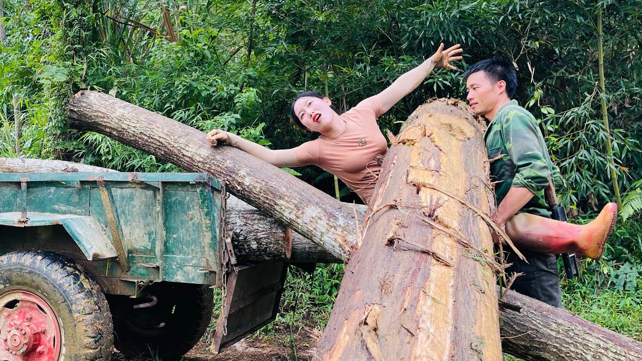 Agricultural vehicles transporting timber are quite dangerous when men are nearby.