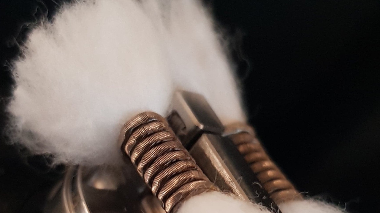 the Redemption RDA on Outback Vaping titanium top cap and silver deck