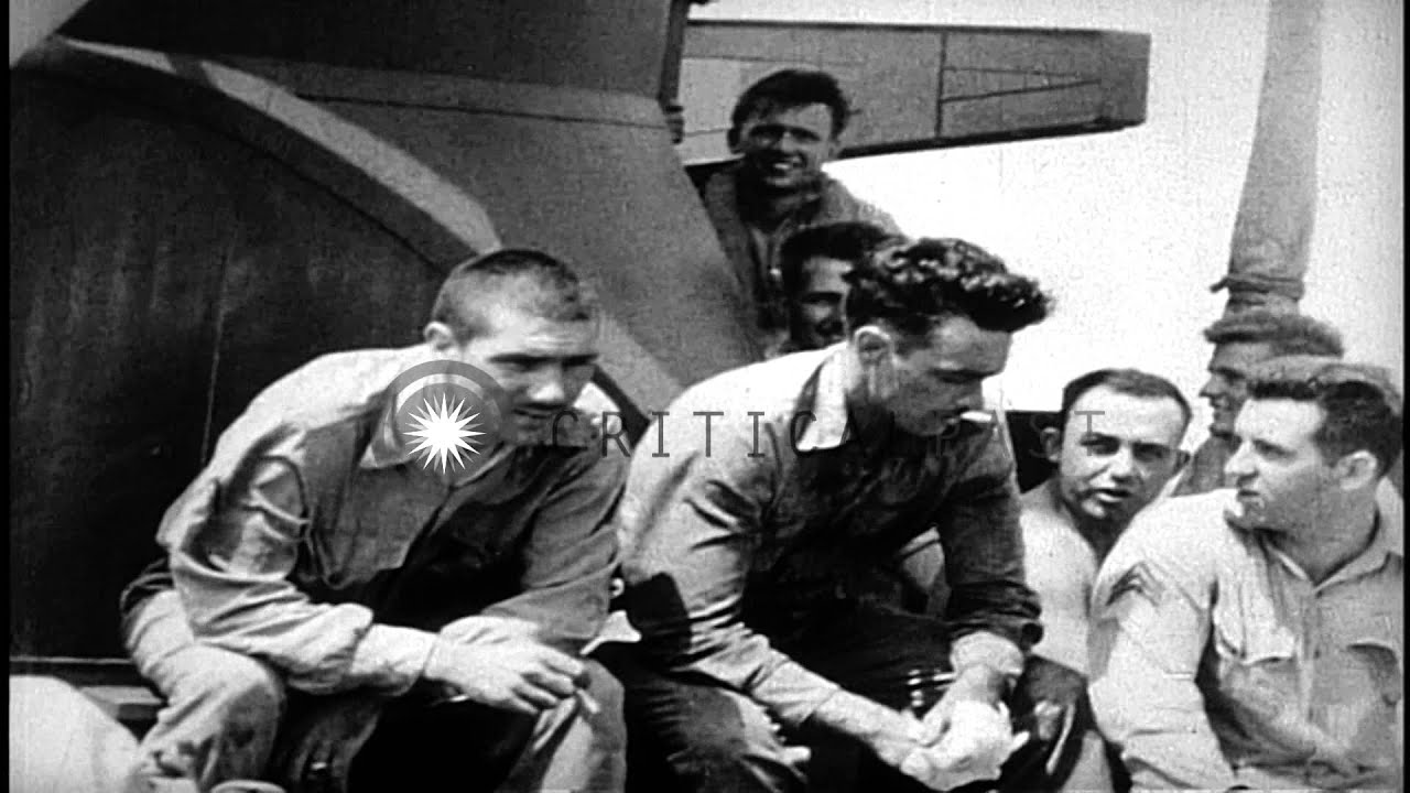 Survivors of the USS Wasp  (CV-7) stand on the deck and bridge of a Destroyer shi...HD Stock Footage