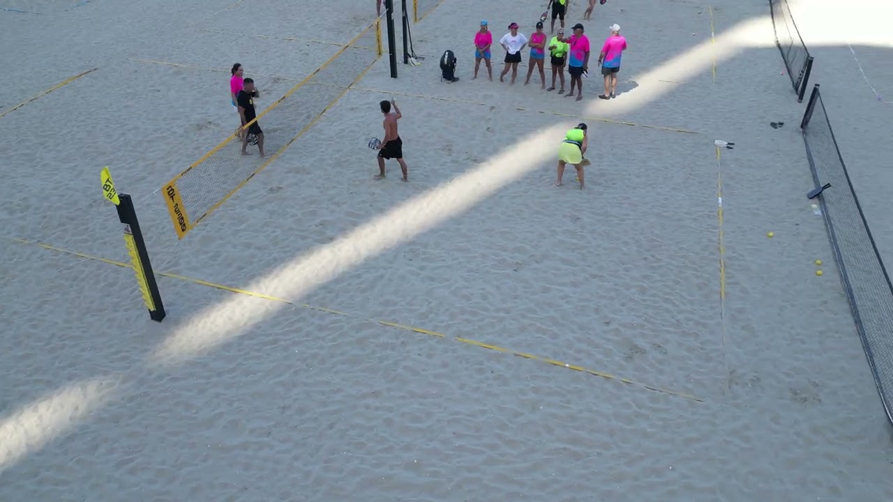 Sandy Pickle is a modified version of pickleball played on grass and sand.