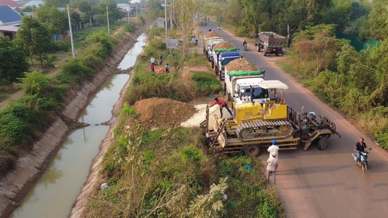 Amazing Nissan truck waiting dumping soilrock filling cleaning forestry with skill dozer d31 pushing