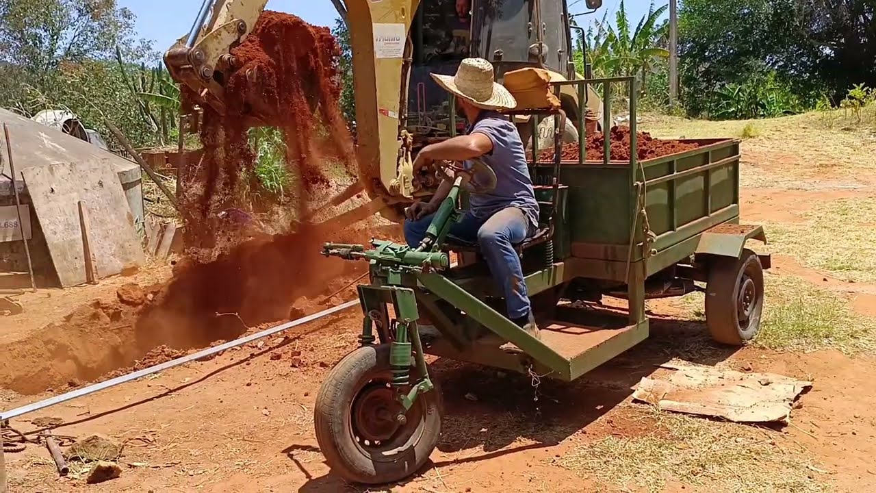 Olha o peso que esse triciclo pode 3 concha de terra 