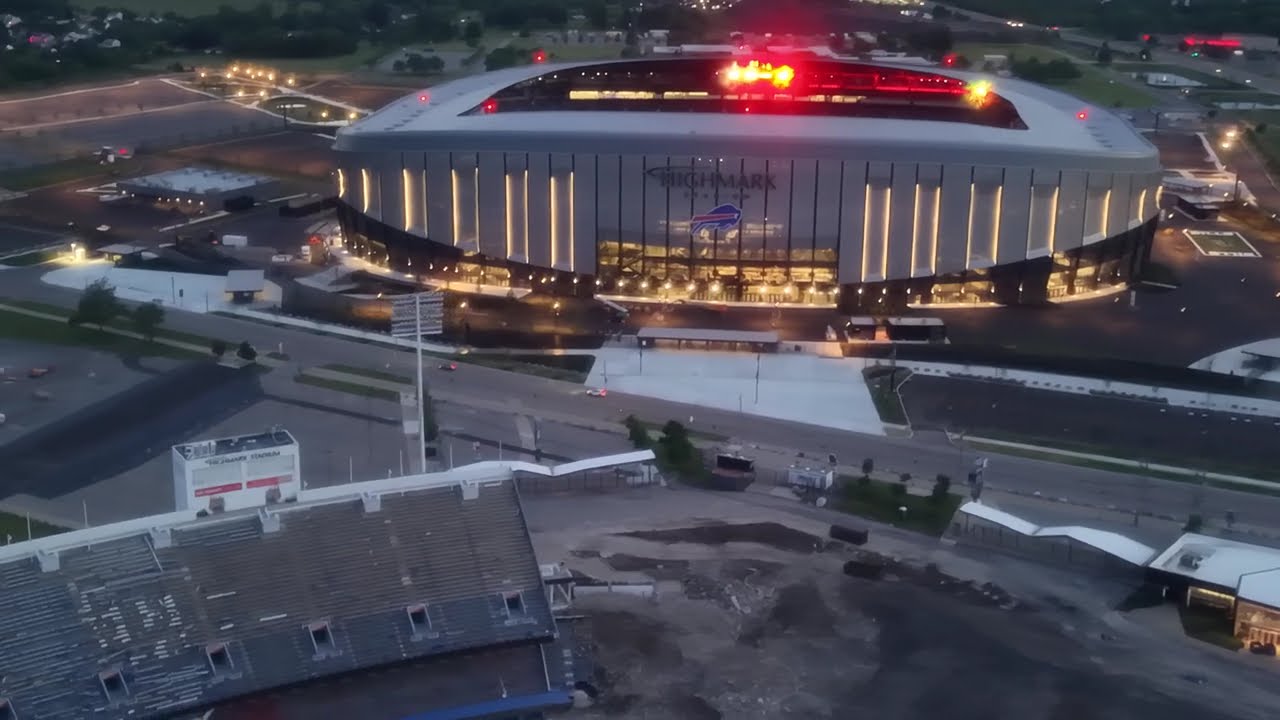 Highmark Buffalo Bills Stadium old & new at dusk.