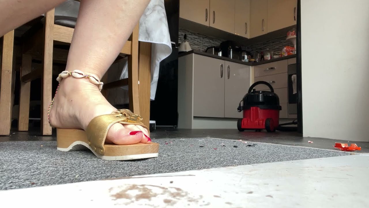 Clog-clad cleanup: Vacuuming crushed toy cars with my soft size 5 soles
