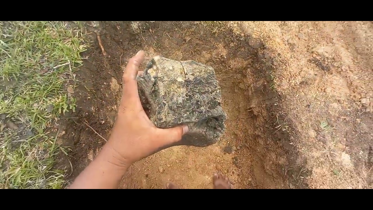 Stone muhon with small clam shell marker in Yamashita Treasure hunting