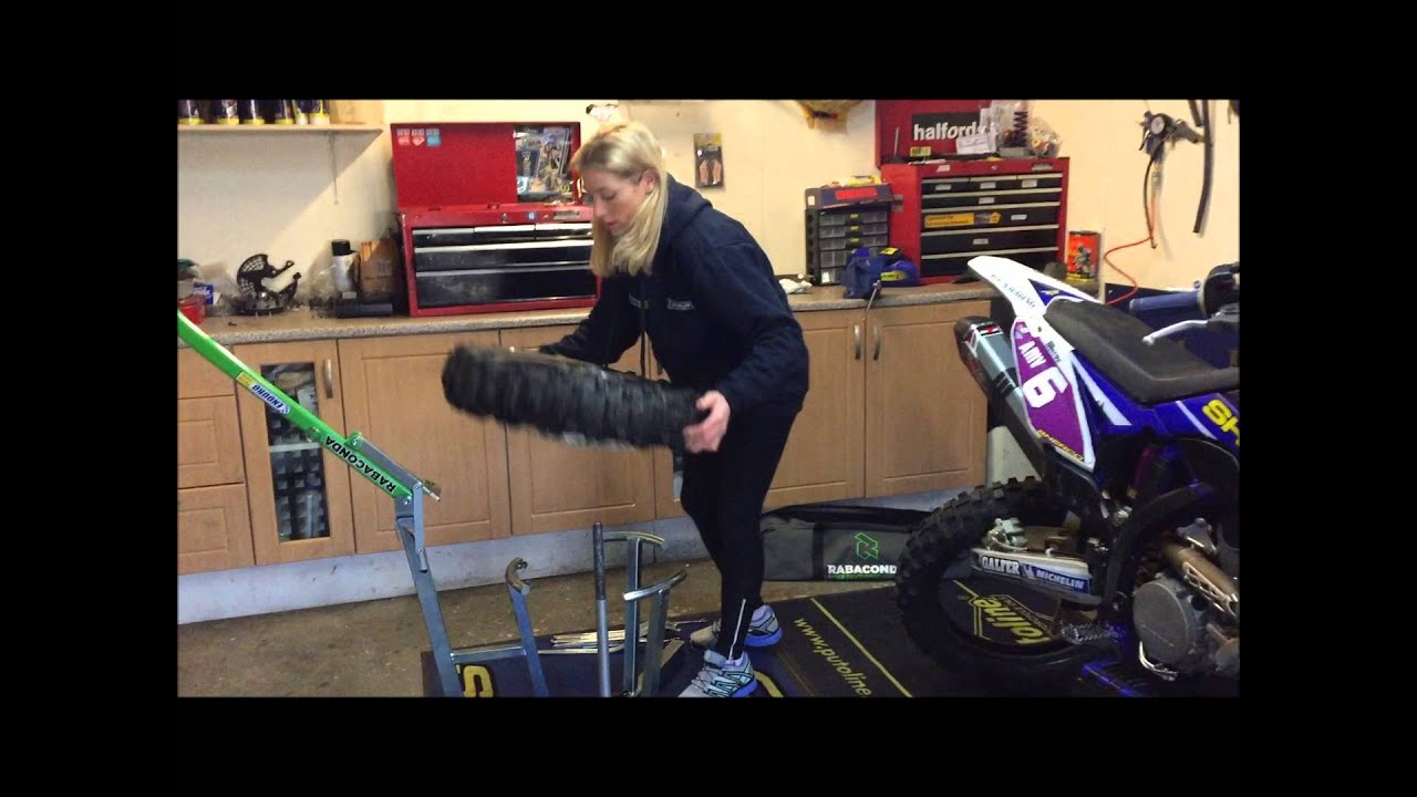 Emma Bristow using Rabaconda to change michelin enduro tyre with mousse