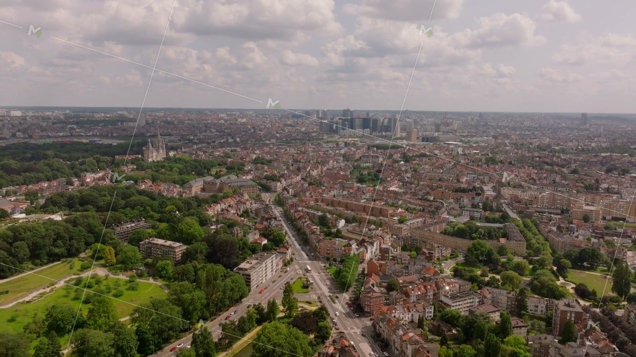 Aerial view of Brussels, Belgium. The camera is panning over the city, showing the cityscape with