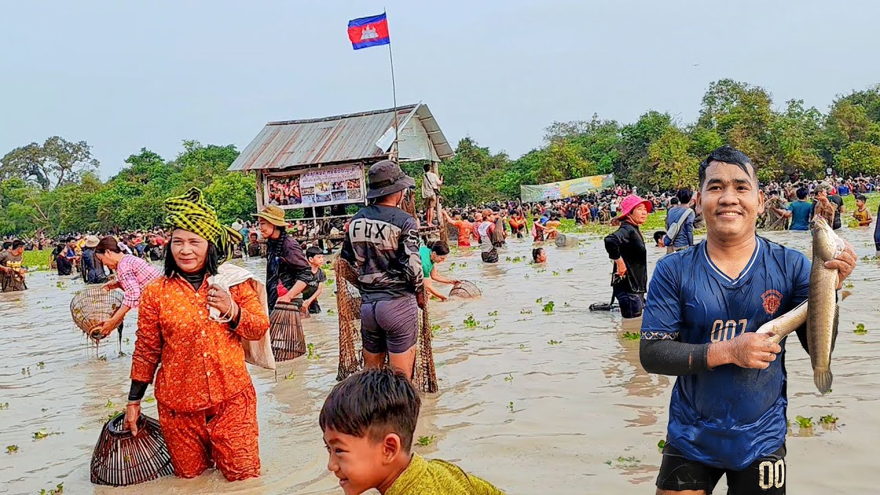 The crowded people fishing in community lake looking very happily.