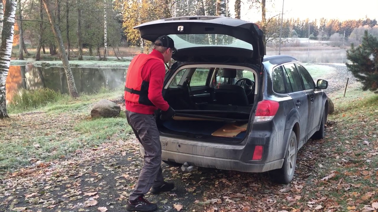 Taking Viisk foldable plywood boat out of the car.