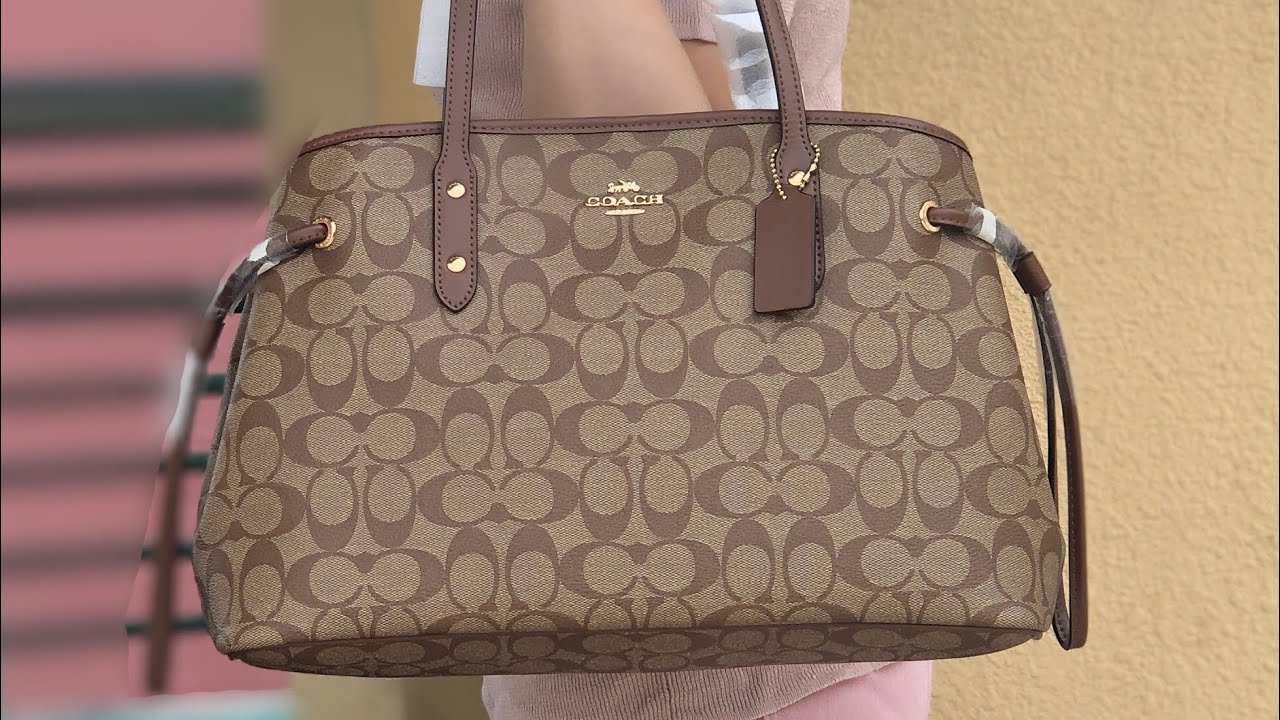 Coach signature drawstring carryall bag khaki saddle