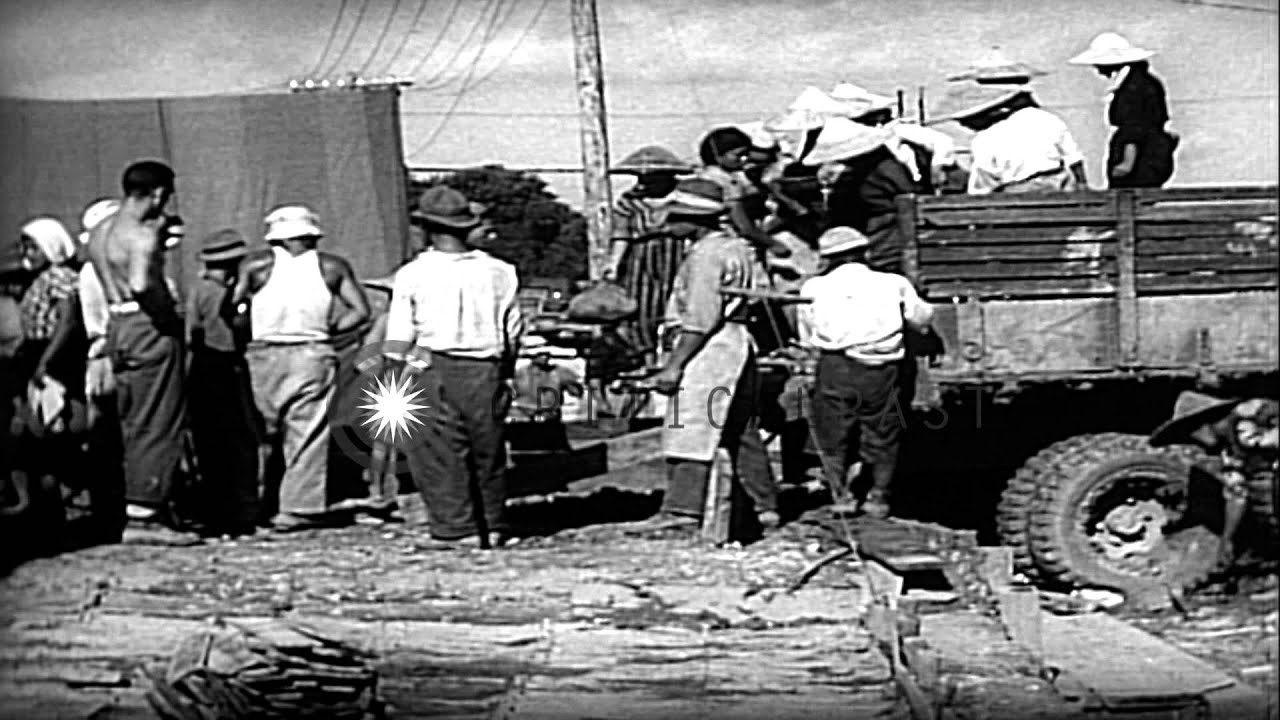Japanese cemetery and native workers work at various jobs in Okinawa, Pacific The...HD Stock Footage