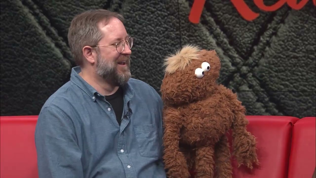 Puppeteer David Stephens on the Red Couch