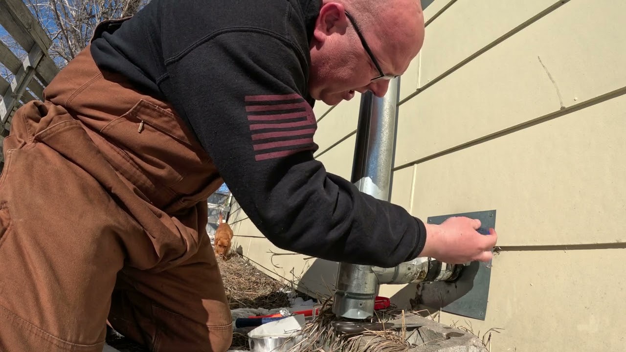 Cleaning out the pellet stove chimney to be ready for the next snowstorm