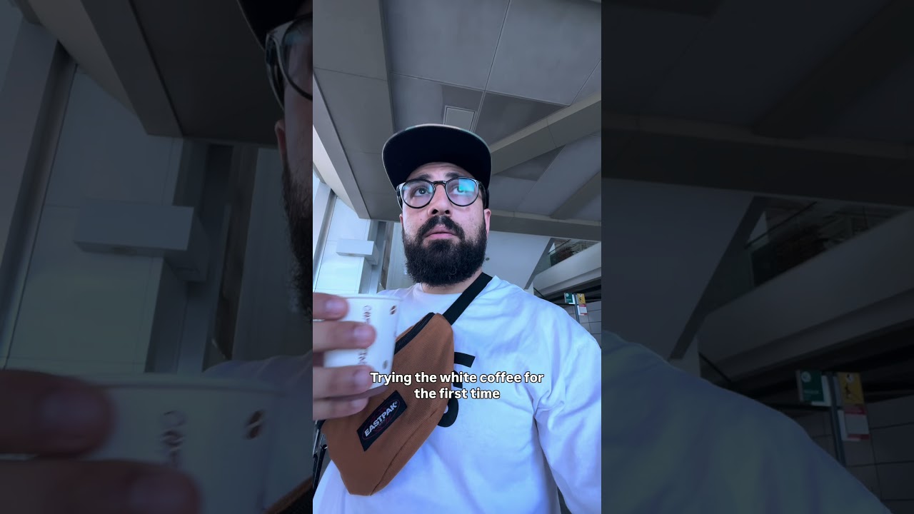 Trying white coffee from a vending machine in Steel Mosque in Malaysia!