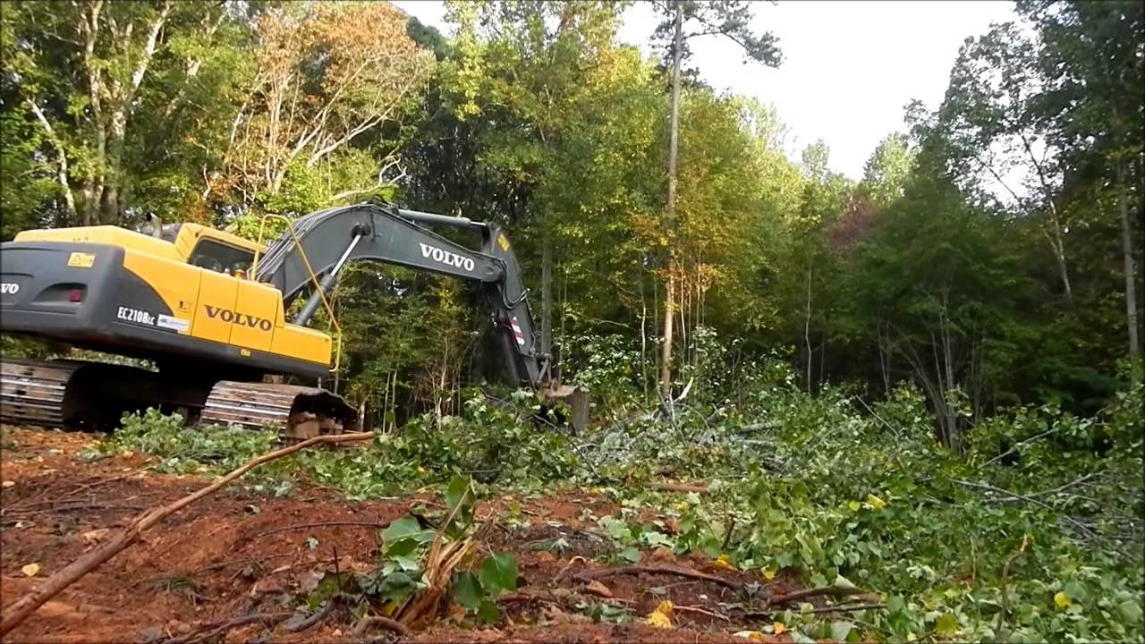 Excavator Clearing Land