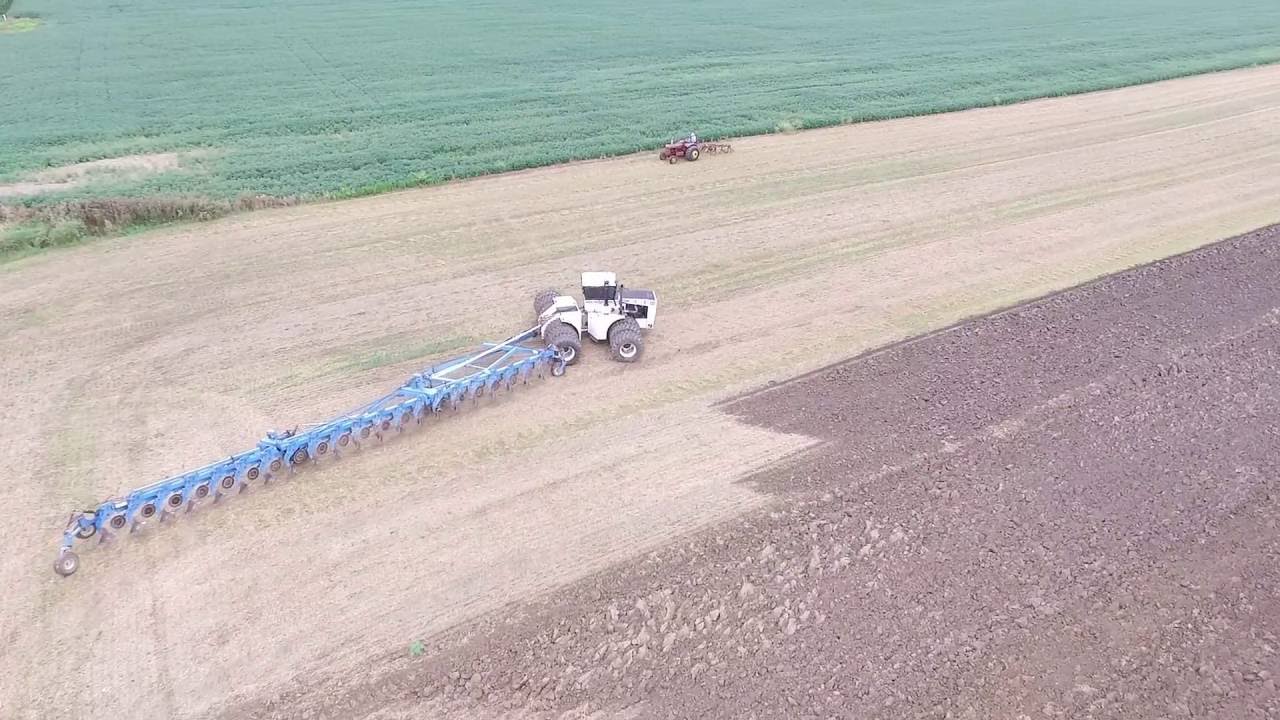Big Bud Pulling HUGE 21 Bottom Plow!!!