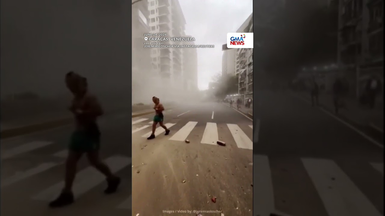Eyewitness video captures people fleeing through dusty Caracas street following... GMA News