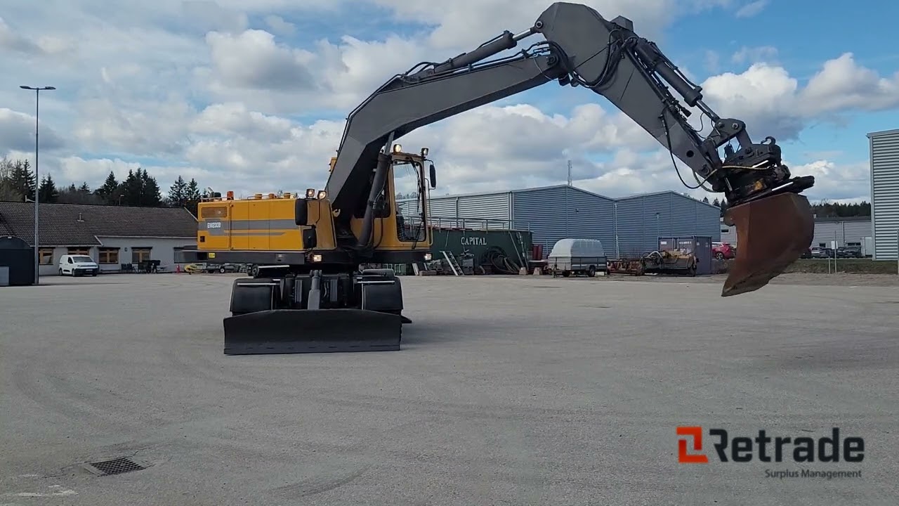 ÅKERMAN - VOLVO EW230B Hjulgrävare / grävmaskin med rotortilt finns på auktion hos Retrade.eu