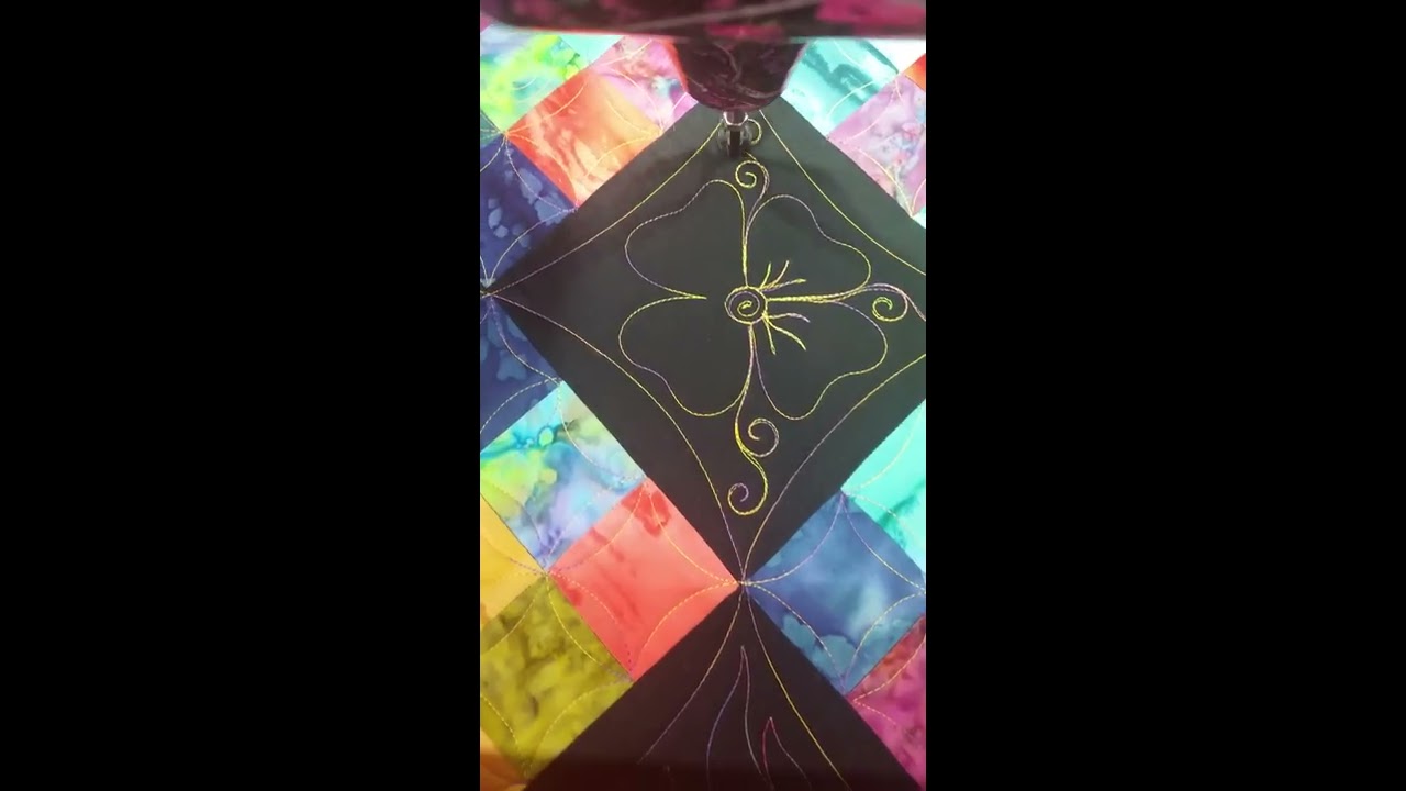 Wavy edge flower with curls,  longarm freemotion quilting