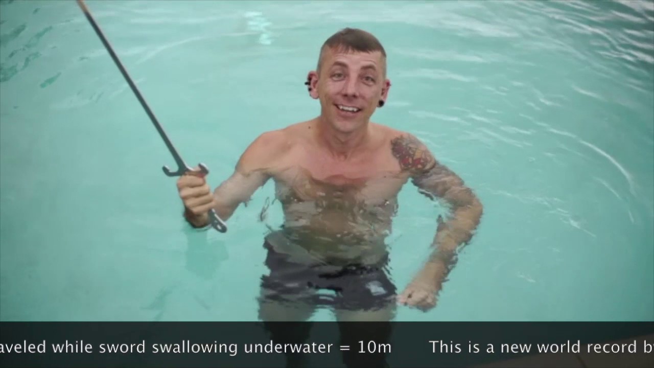 Longest distance travelled underwater while sword swallowing -World Record Attempt