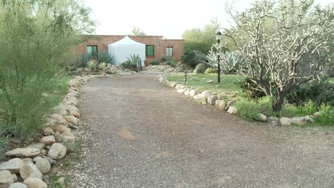 White tent placed directly outside Nancy Guthrie’s front door
