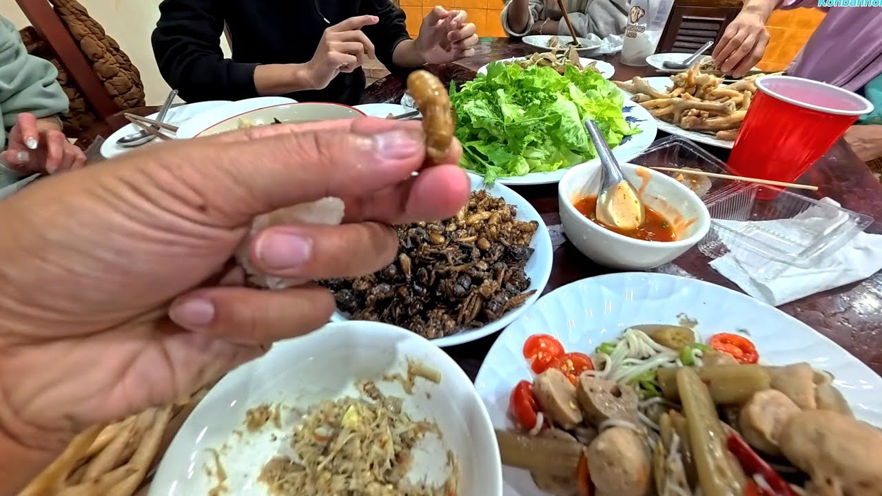 Eating bugs for dinner at our cousins house in Laos.