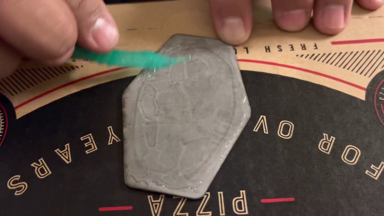 Using E6000 to Glue a Leather Patch on a Hat.