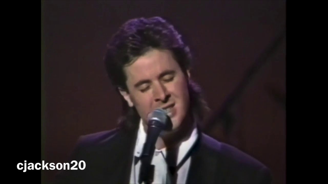 Vince Gill and Carl Jackson, singing, 