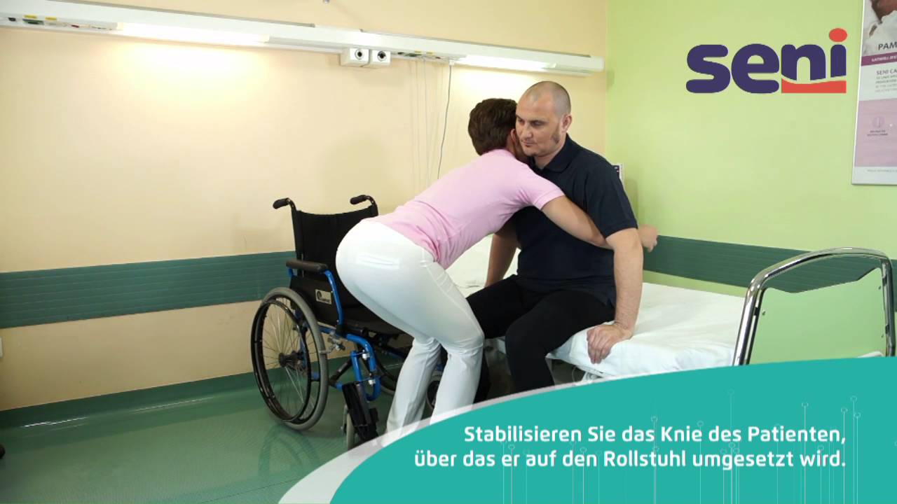 [DE] 03 Seni - Patiententransfer vom Rollstuhl ins Bett mit Kniestabilisierung