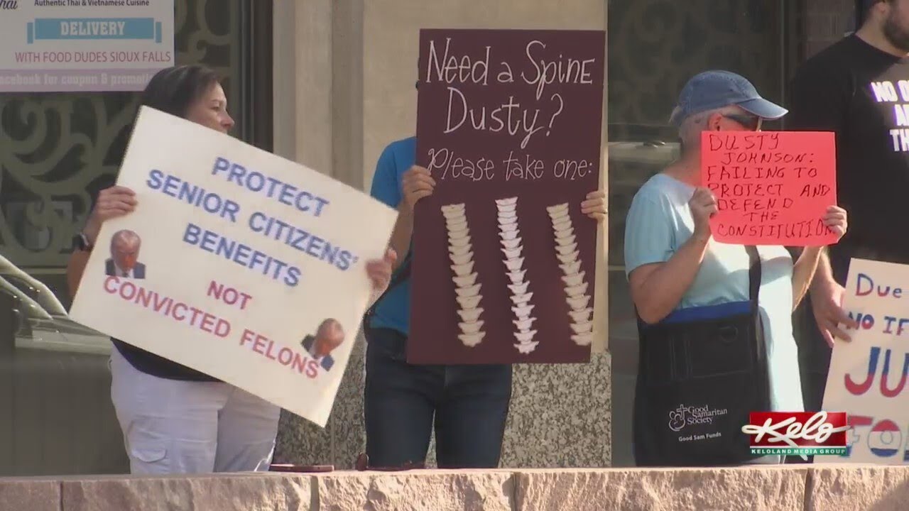 Protesters in downtown Sioux Falls for Senior Citizens Day