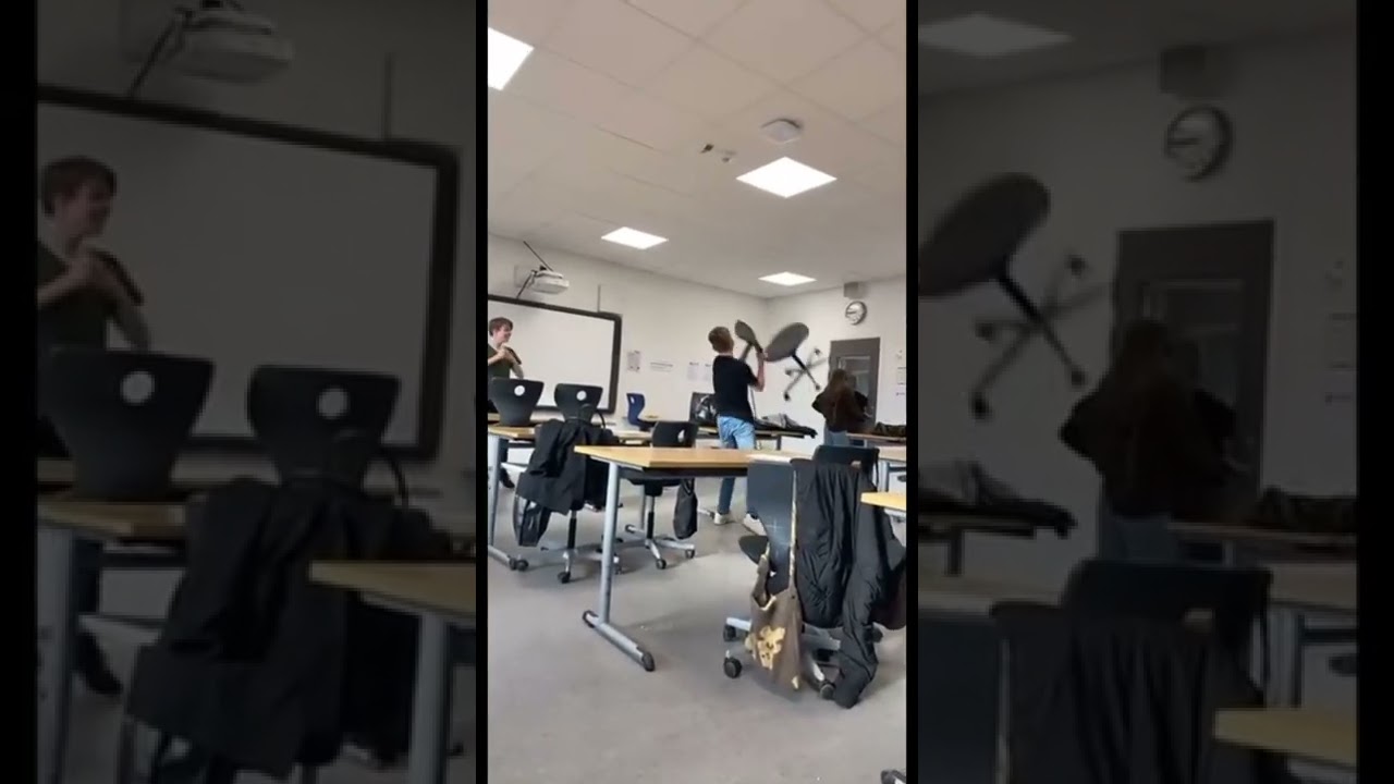 Guy gets angry and throws chair in class