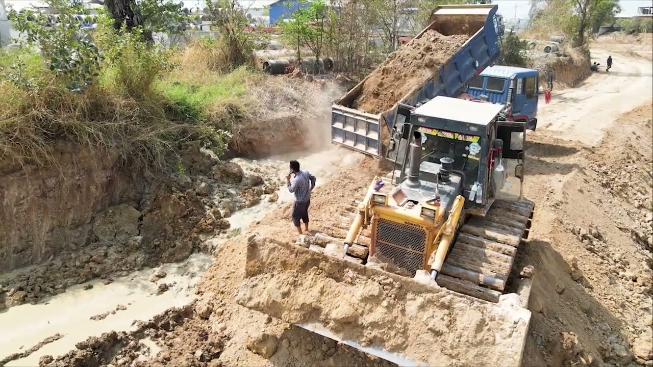 Wonderful dump truck wheel 10 unloading soil repair road and Bulldozer working push stone landfill 
