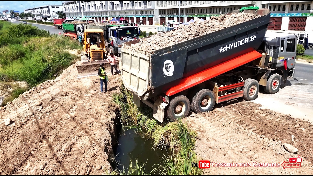 Massive Hyundai Dump Trucks Dumping Soil Huge Size Landfill And Using Skills Dozer Pushing Soil