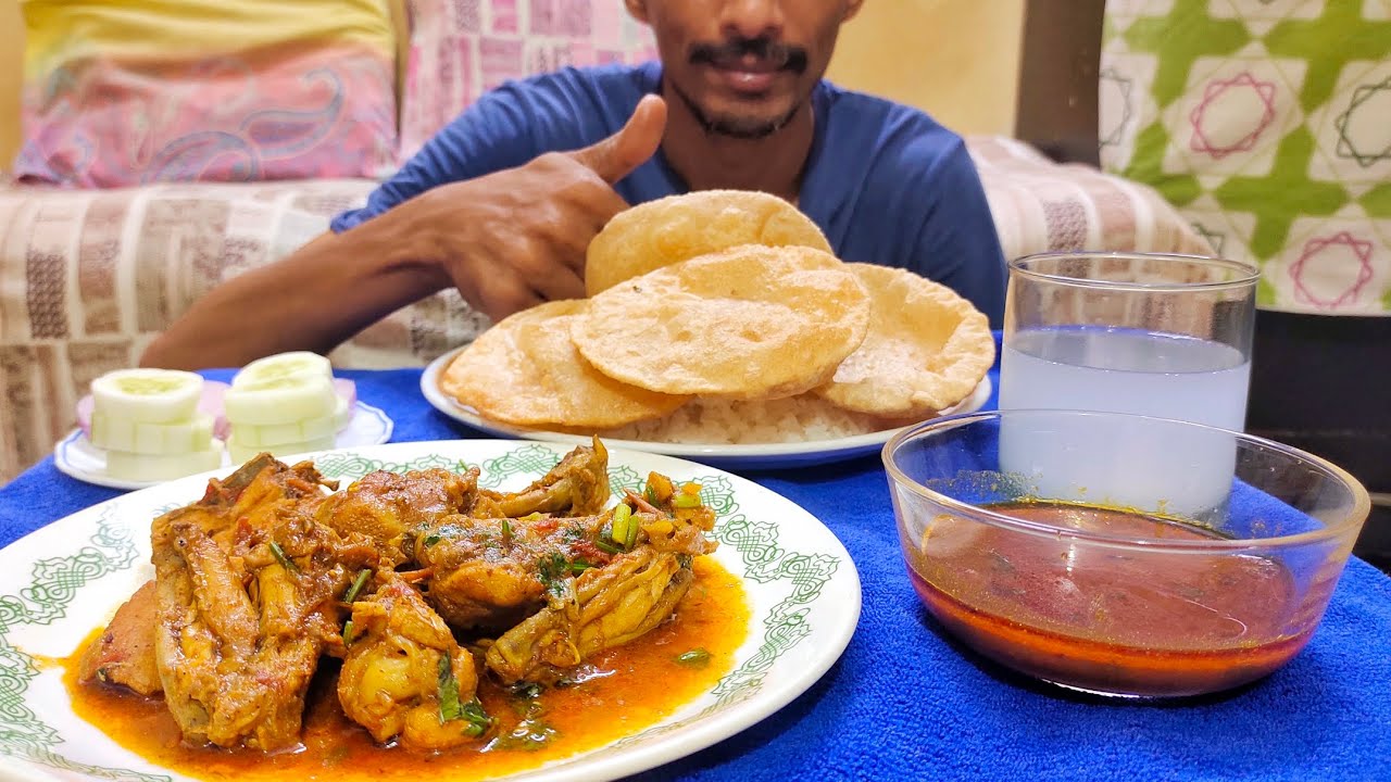 CHICKEN CURRY AND PURI WITH RICE AND GRAVY