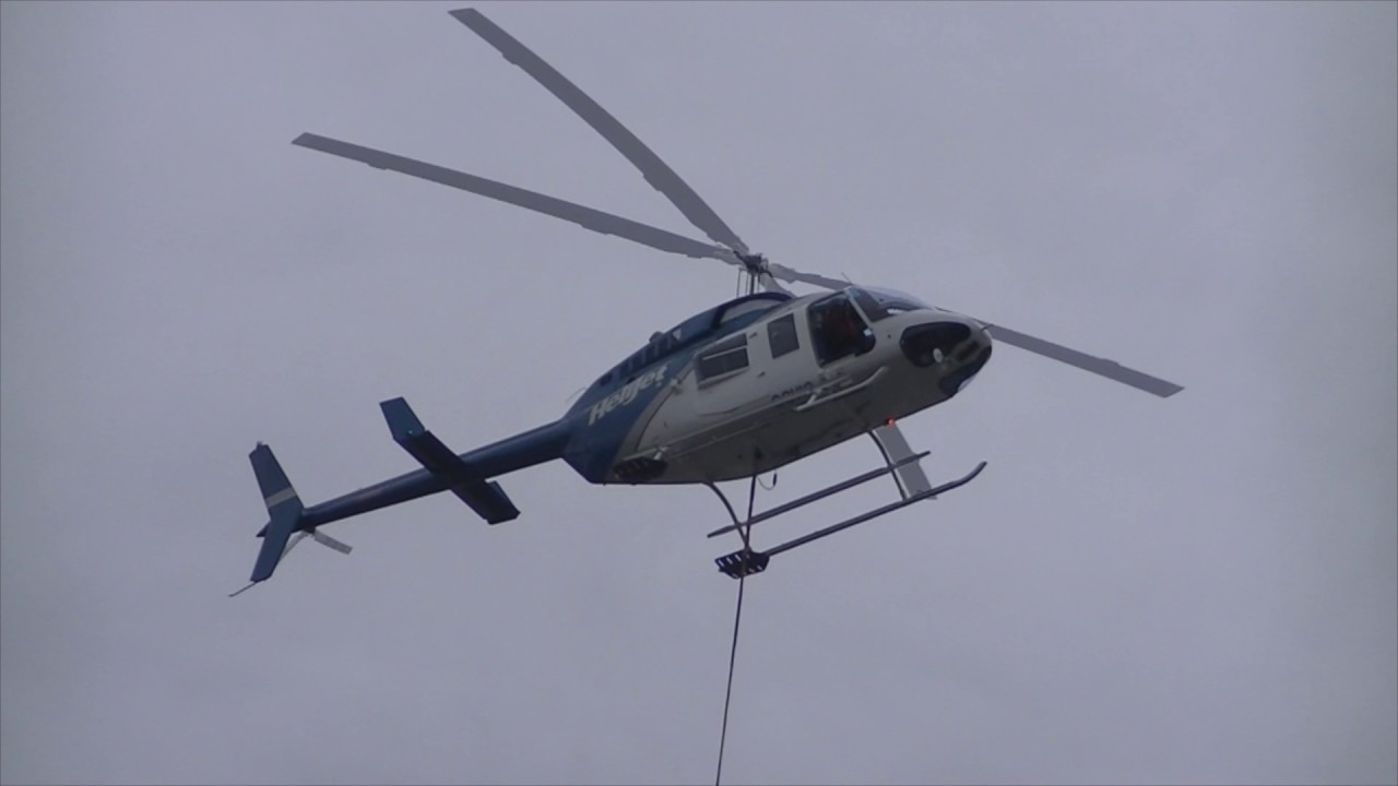 Bell 206L Long Ranger landing with long line in Seal Cove