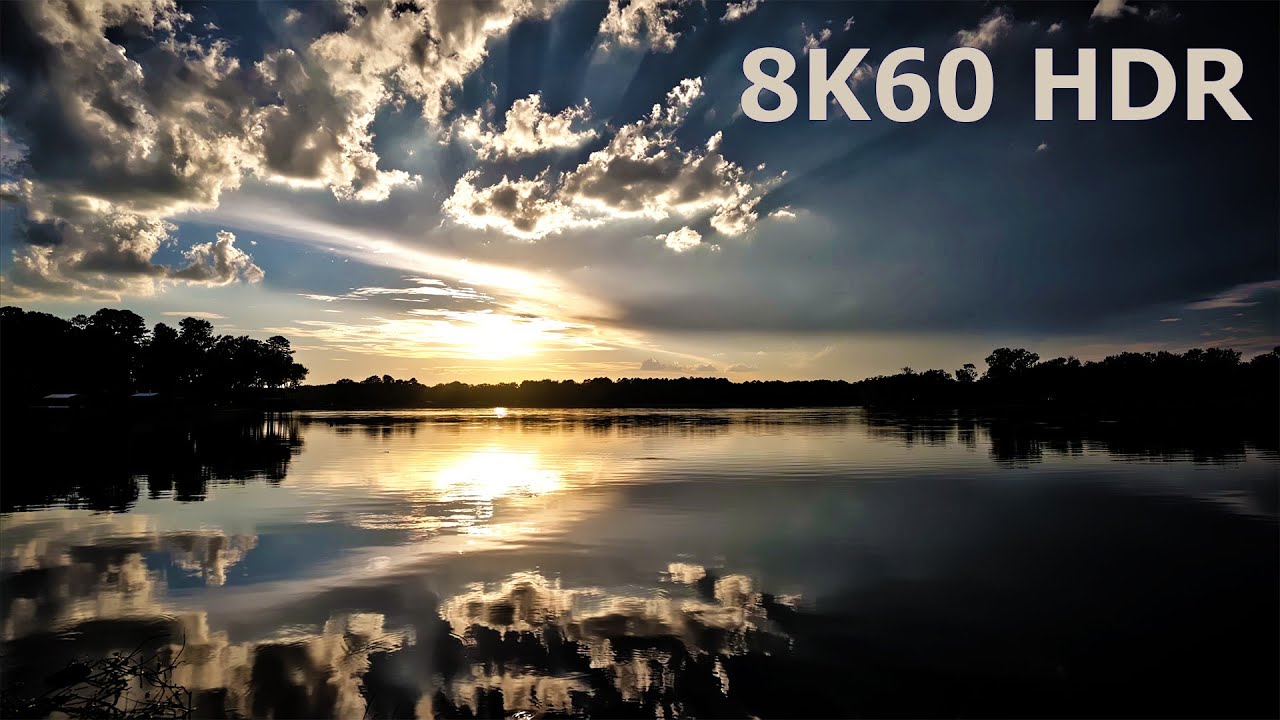 Peaceful sunset reflected on a calm lake and quiet ambient music. 8K60 HDR.