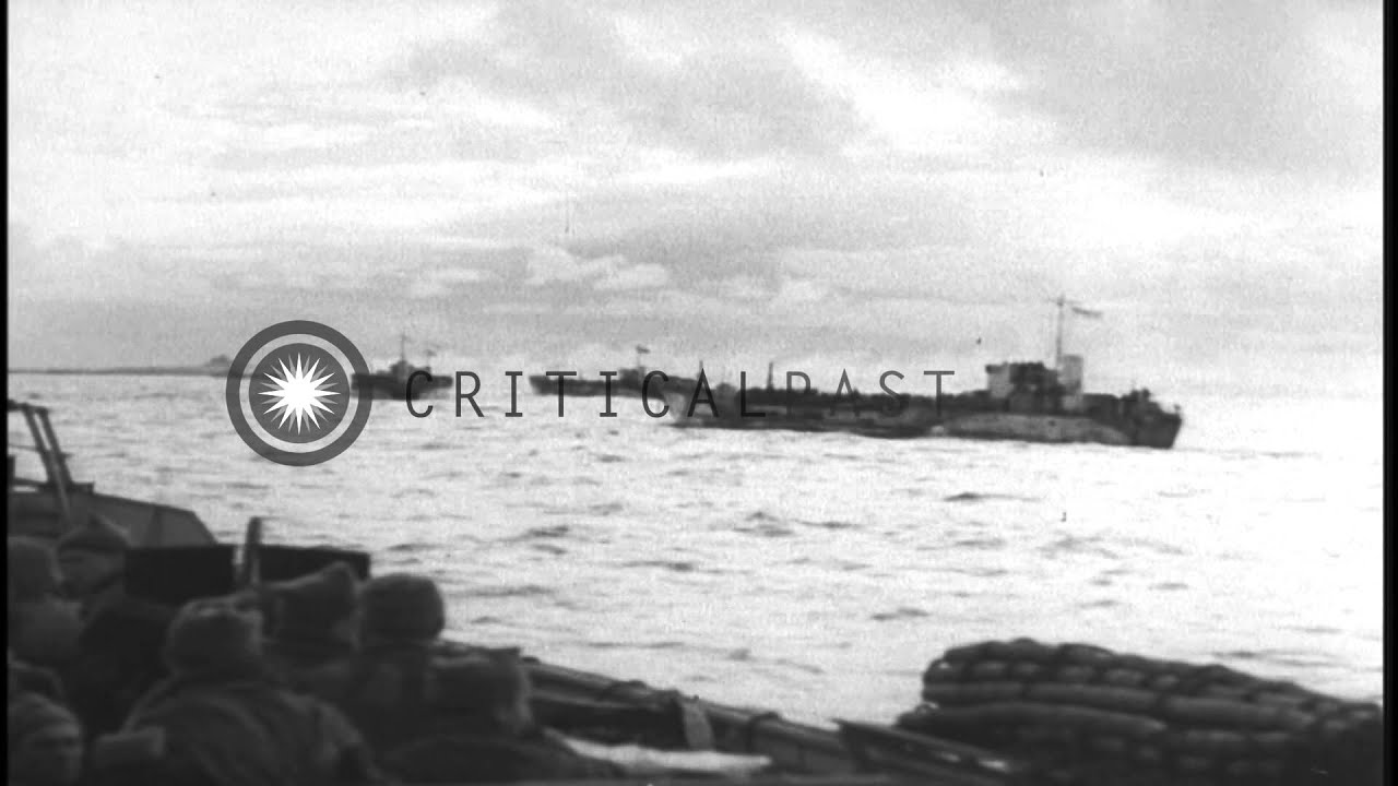 British Marines aboard landing crafts arrive at Walcheren Island in Holland. HD Stock Footage