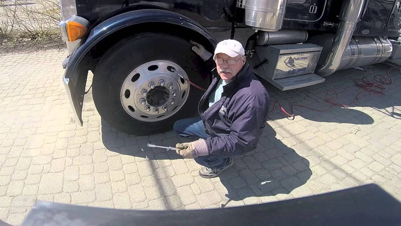 Checking Tire Pressure and Inflating Tires on a Big Rig
