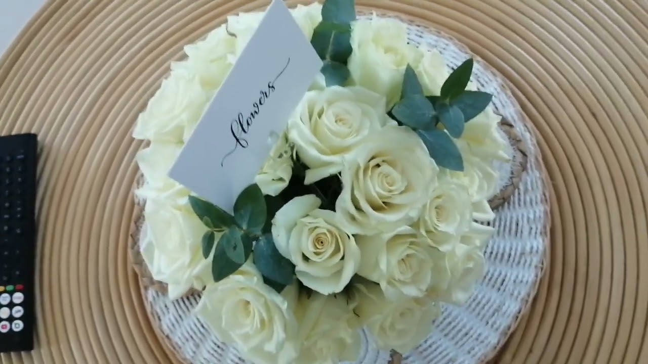 EACH TABLE HAS A BOUQUET OF FLOWERS AS THE CENTERPEICE