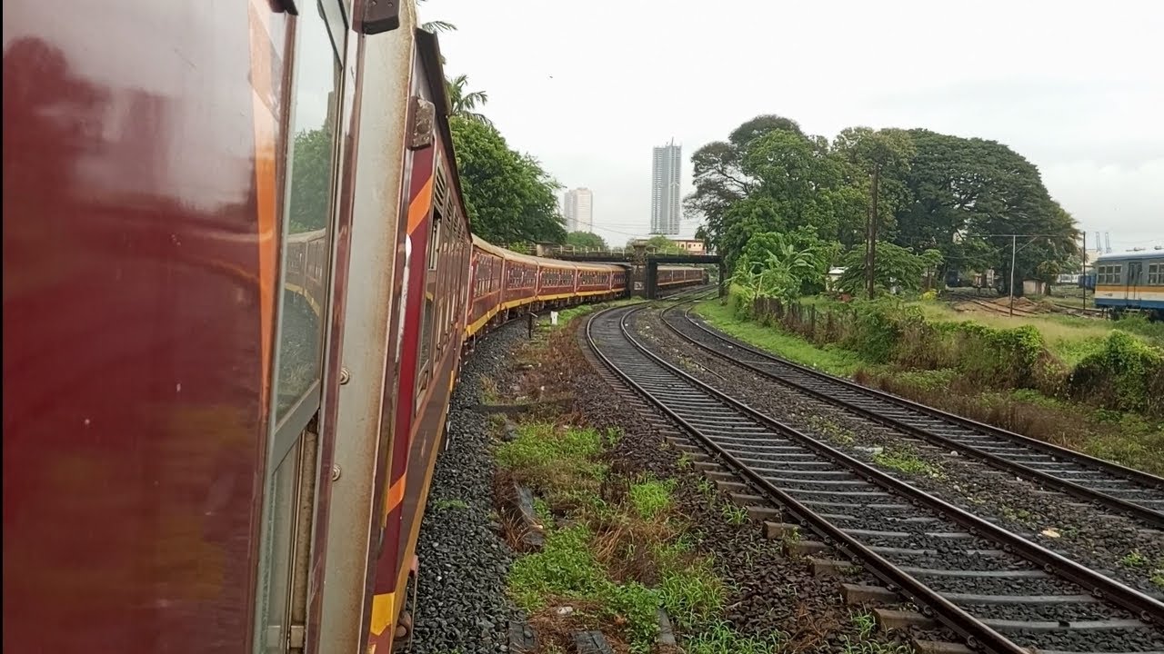 Class M11 Diesel Electrical locomotive Indian Train travel and Maradana Sri Lanka rain day 