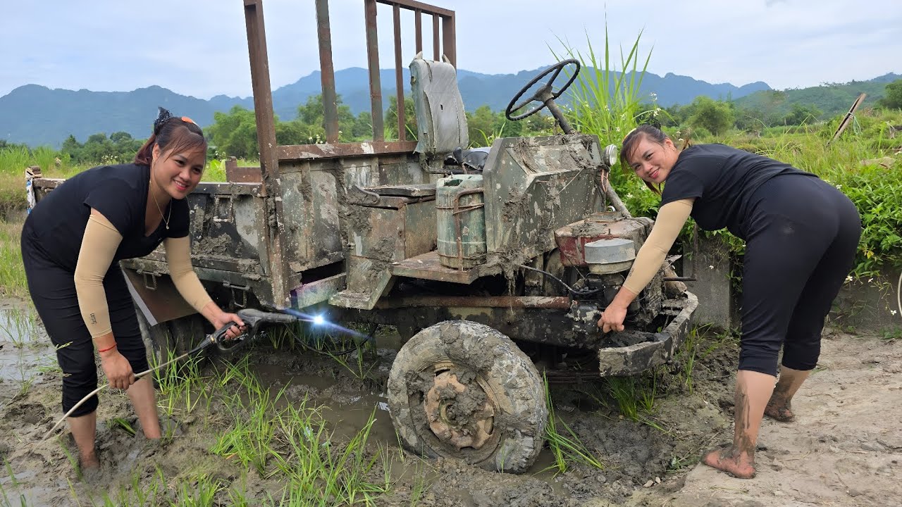 Rescue girl repairs and restores a broken farm car that has sunk into a muddy field.