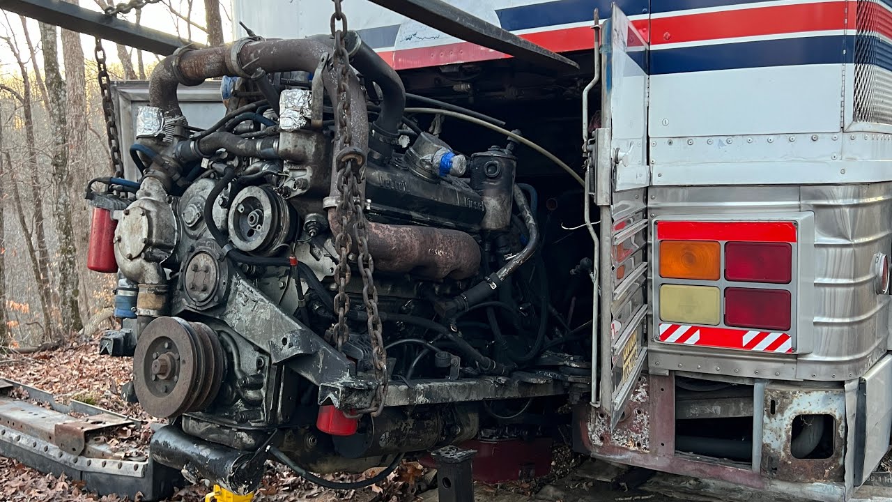 Replacing the detroit diesel 6v92TA engine in mci bus. Sliding cradle in with a new holland tractor