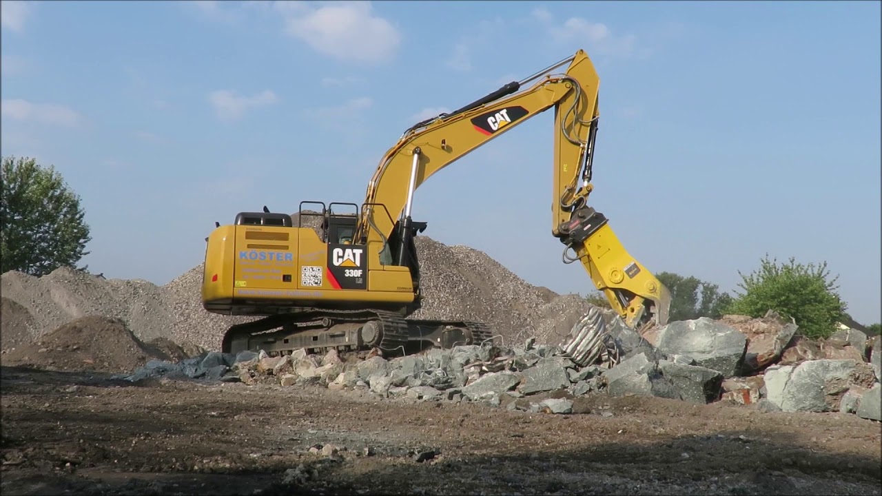 Bagger CAT 330F mit Betonpulverisierer
