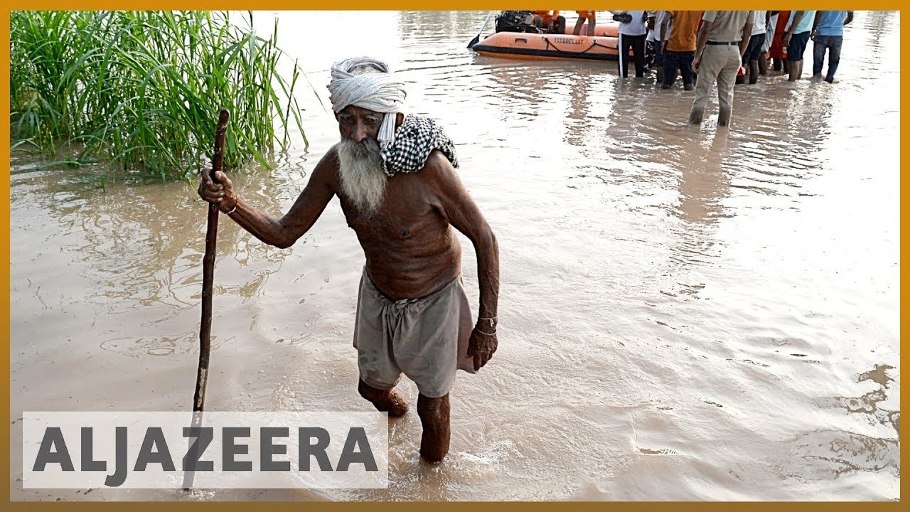 India floods: Monsoon rains destroy homes and farms