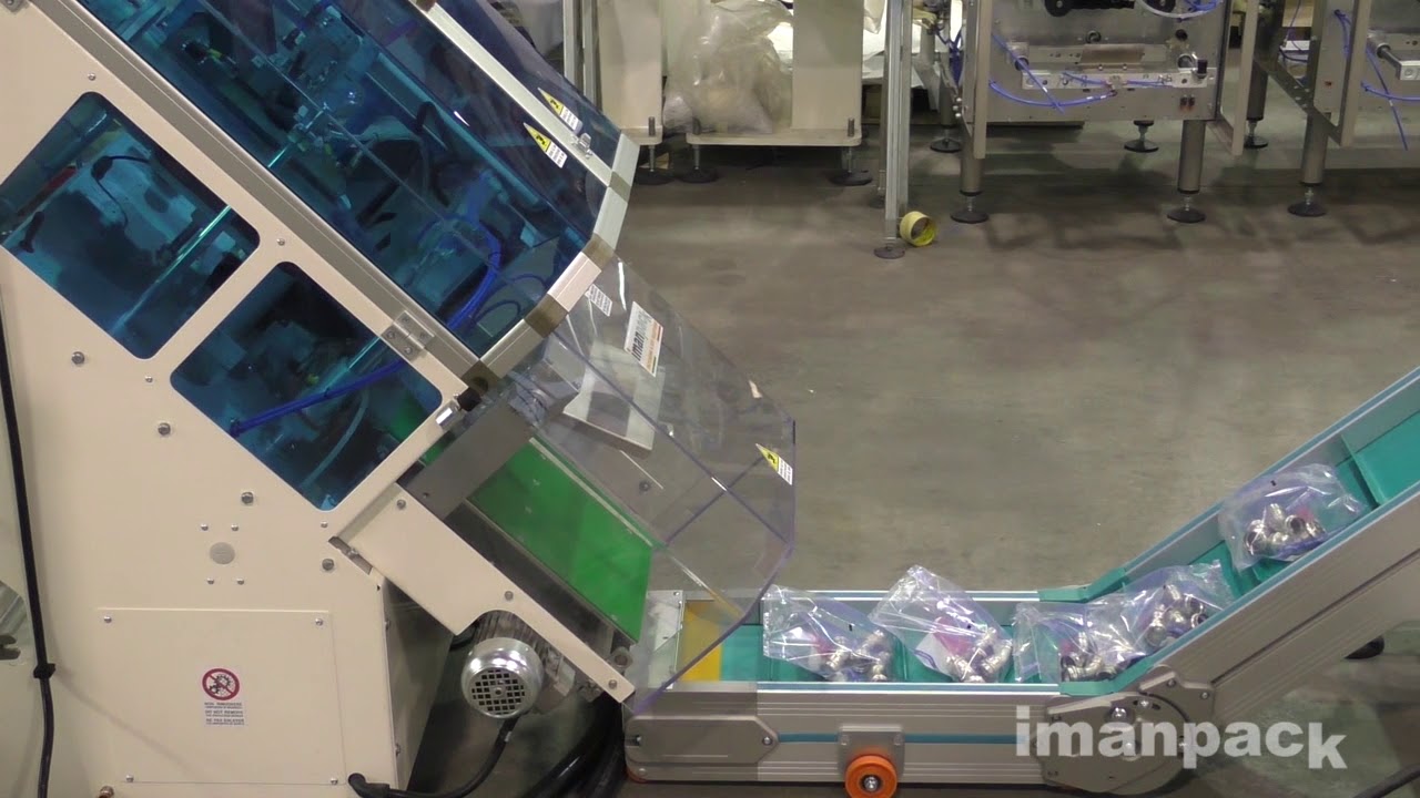 Inclined packaging machine for fittings