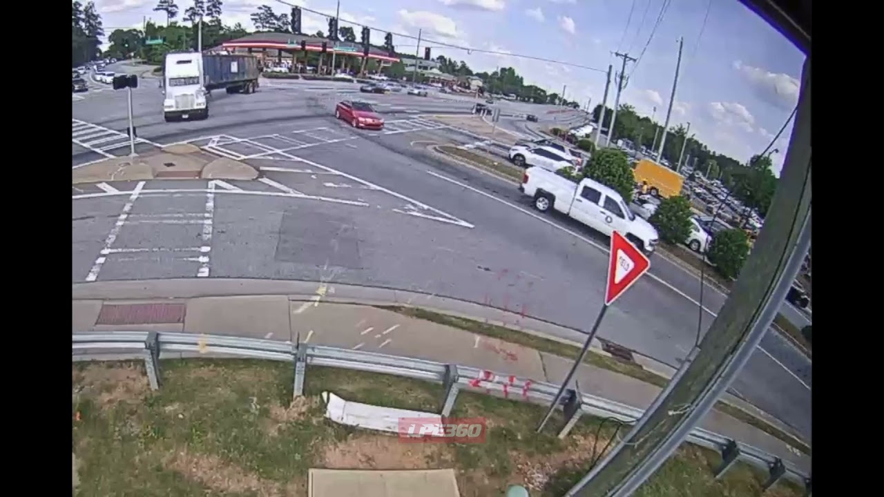 Overloaded tractor trailer flips on turn