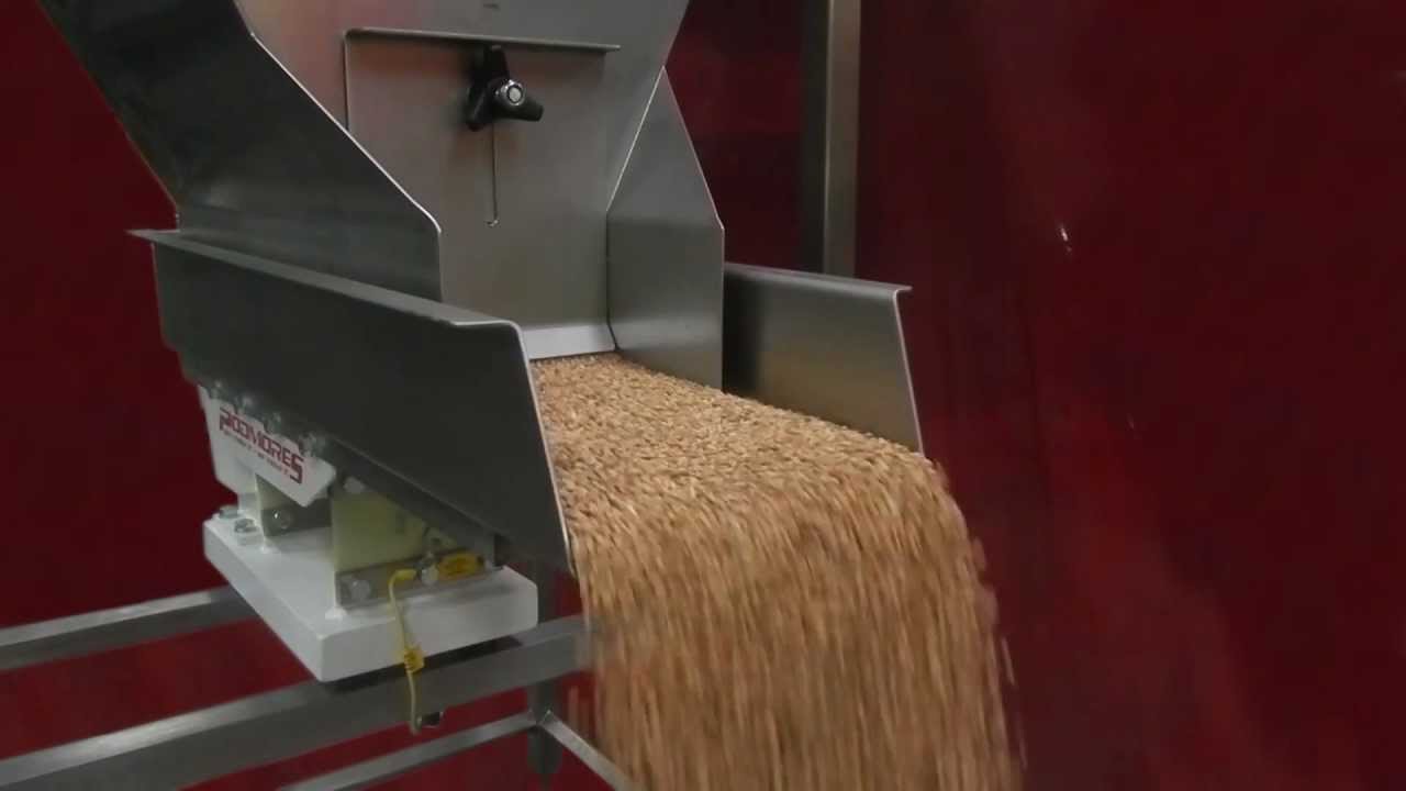 Podmores Hopper Unloader feeding barley