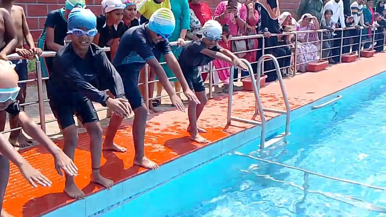 Young swimmers diving into success!Where courage meets the water!