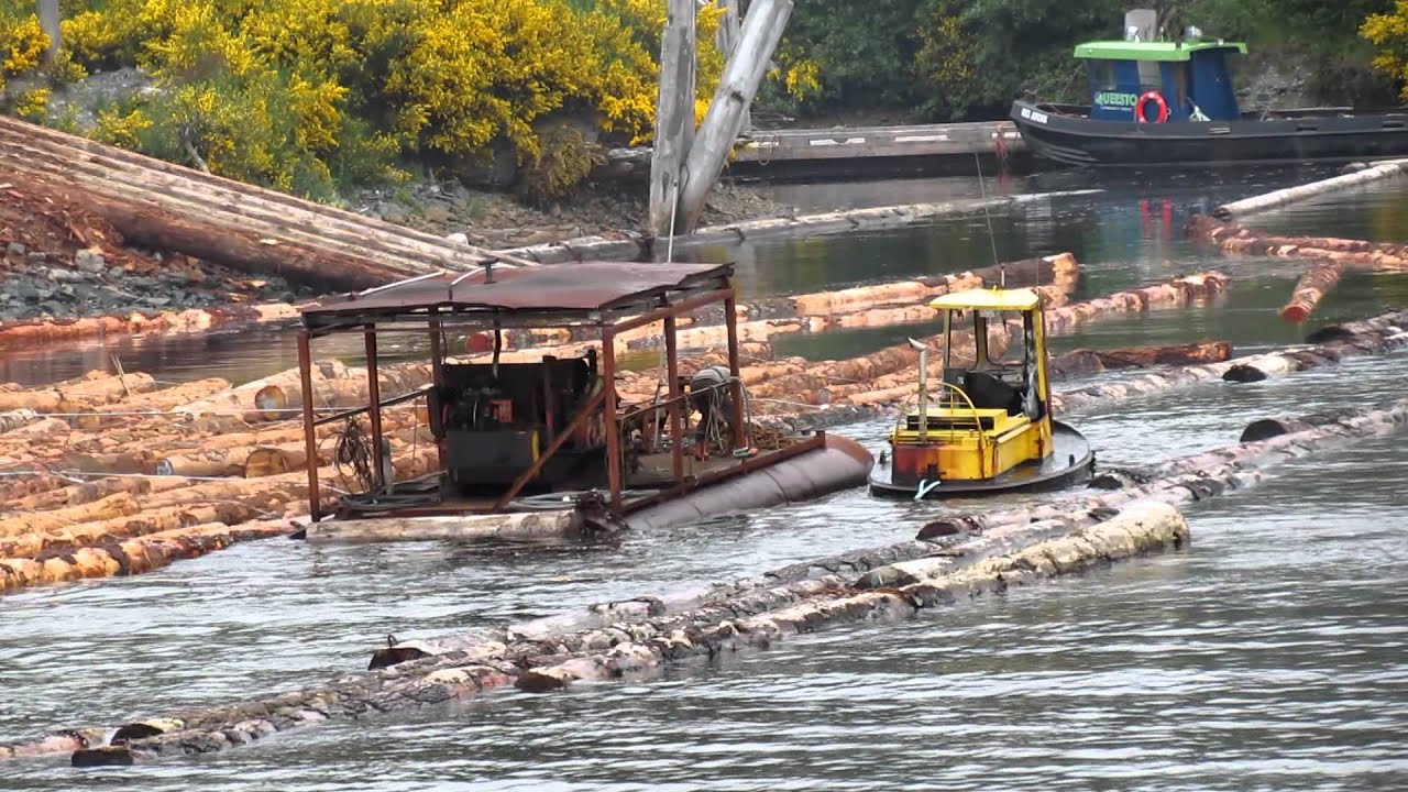 Boomboat assembling a  lograft at Jordan River on Vancouver Island.